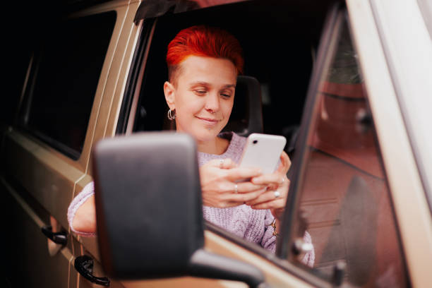 istock Redhead woman using smartphone in camper van 2186132704