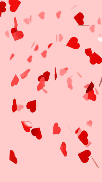 istock Heart shaped confetti on pink background 2186135781