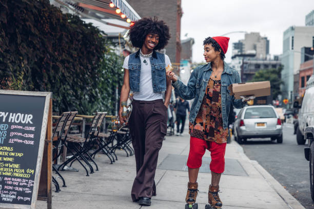 istock Friends on roller skates having lunch break with pizza 2186137532