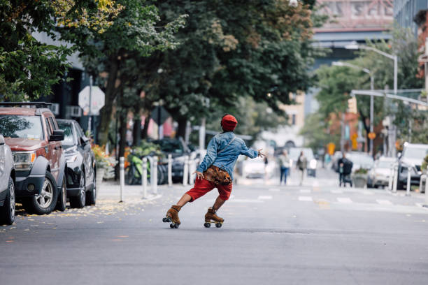istock Woman riding roller skates in the streets 2186138410
