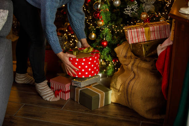 istock Woman prepairing Christmas presents 2186147873
