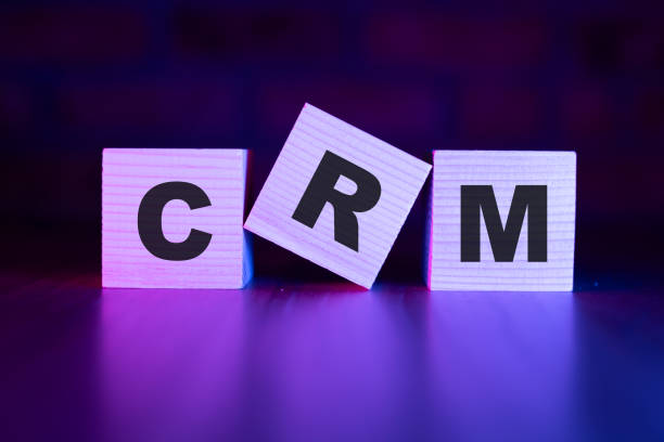 CRM word with wooden blocks on table