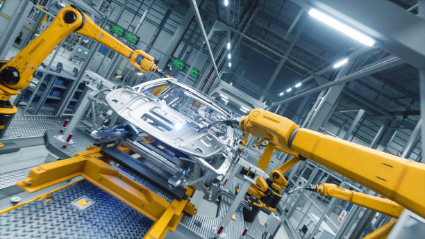 istock Autonomous Factory with Robotic Arms Autonomously Assembling Car Frames At the Factory. Artificial Intelligence, Precision Production, and Manufacturing of Sustainable Electric Vehicles 2186166807