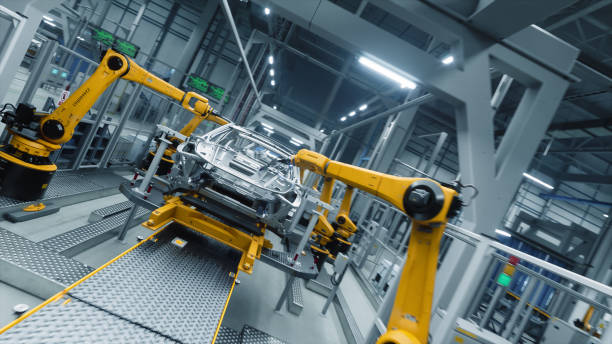 istock Autonomous Factory with Robotic Arms Autonomously Assembling Car Frames At the Factory. Artificial Intelligence, Precision Production and Manufacturing of Sustainable Electric Vehicles 2186166855