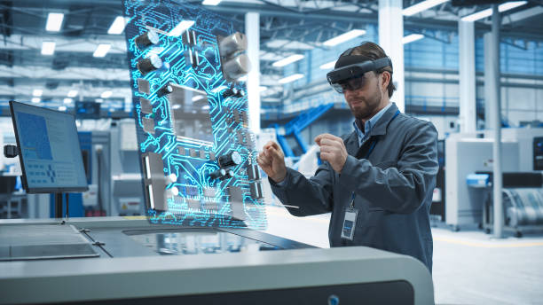 istock Male Engineer Uses Augmented Reality Headset to Interact With Complex 3D Holographic Model of Microchip in Advanced Manufacturing Facility, Precision Engineering of Computer Hardware in the Factory 2186169464
