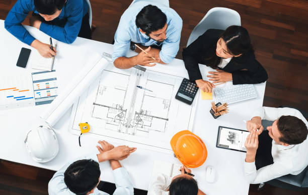 istock Diverse group of civil engineer and client working on architect. Prudent 2186169608