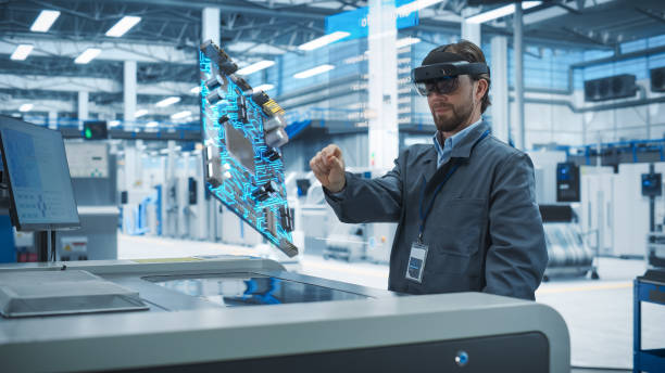 istock Male Engineer Uses Augmented Reality Headset to Interact With Complex 3D Holographic Model of Microchip in an Advanced Manufacturing Facility, Precision Engineering of Computer Hardware in Factory 2186169713