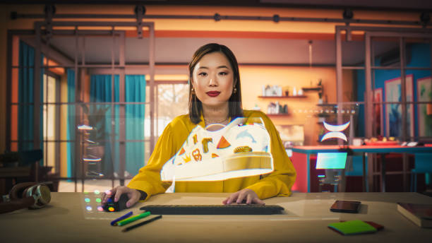 Asian Female Designer Uses a VFX Hologram Screen to Create a 3D Shoe Design in a Graphical Interface Software. Young Professional Entrepreneur doing Digital Fashion, Sneaker and Clothing Deisgn
