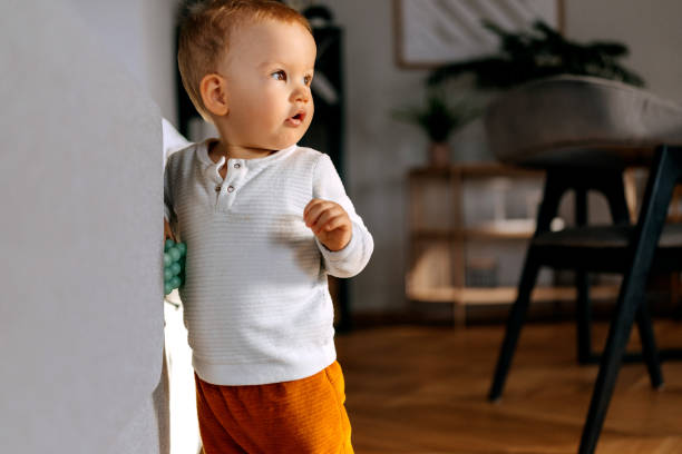 istock Cute baby boy wandering around house 2186171930