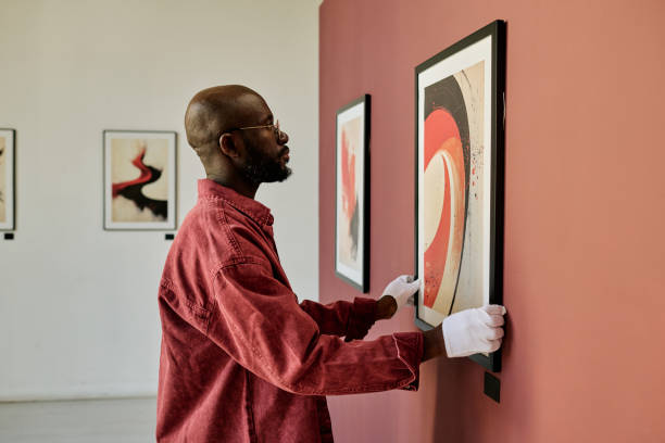 istock African American Man Examining Artwork in Gallery 2186177989