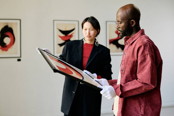 istock Examining Modern Art Exhibits in Gallery Setting 2186179567