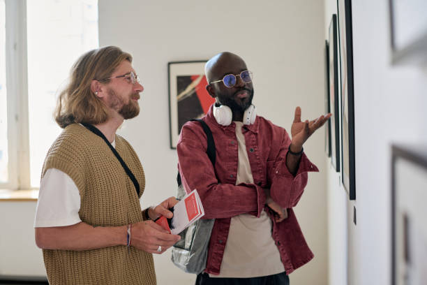 istock Discussing Art at Modern Art Exhibition 2186179635
