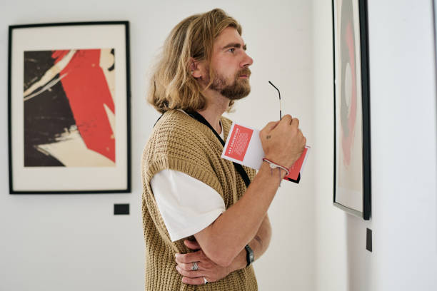 istock Contemplating Art in Modern Gallery Setting 2186179647