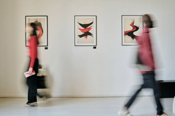 istock People Observing Modern Art in Contemporary Gallery Setting 2186180256