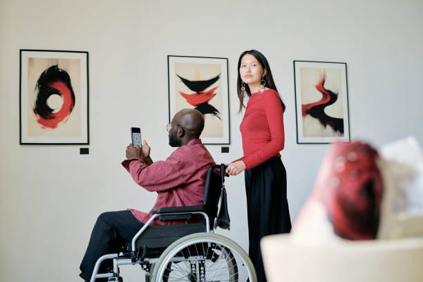 istock Observing Abstract Art in Wheelchair at Modern Gallery 2186180361