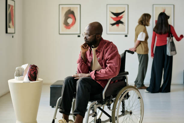 istock Observing Art Exhibition While Sitting in Wheelchair 2186180526