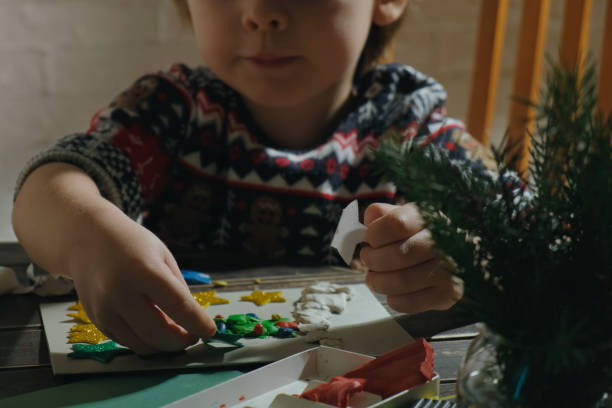istock Child makes Christmas greeting cards. 2186180780