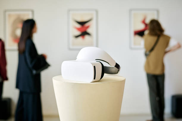 istock Viewing Virtual Reality Device in Modern Art Gallery 2186182153