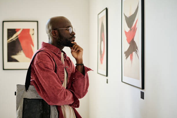 istock Contemplating Art in Modern Art Gallery Setting 2186182209