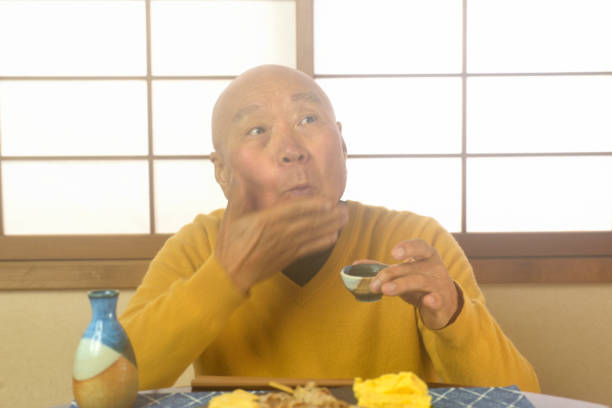 istock An old man relaxing in a Japanese-style room drinking alcoho 2186185888