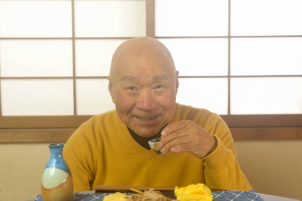 istock An old man relaxing in a Japanese-style room drinking alcoho 2186185905