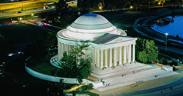Helicopter shot of the illuminated Jefferson Memorial in Washington, D.C. on a clear evening in Fall.