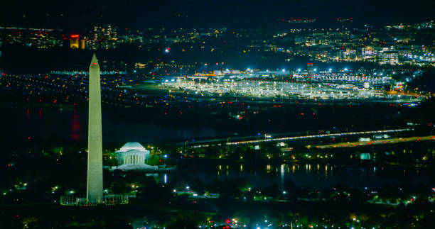 istock Washington, D.C. Monuments with Reagan National Airport Beyond Lit Up at Night 2186187228