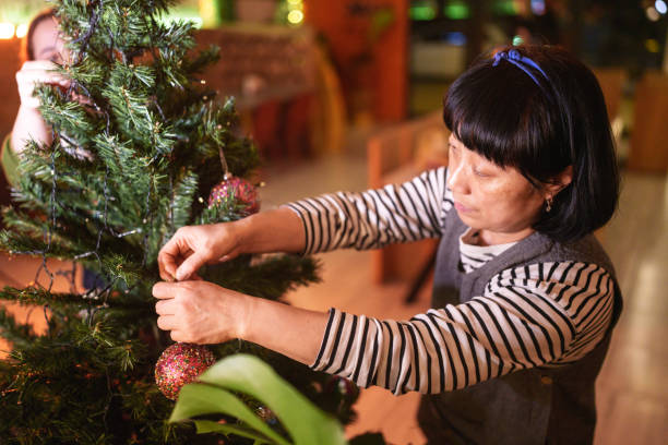 istock Korean woman is decorating a Christmas tree 2186193470