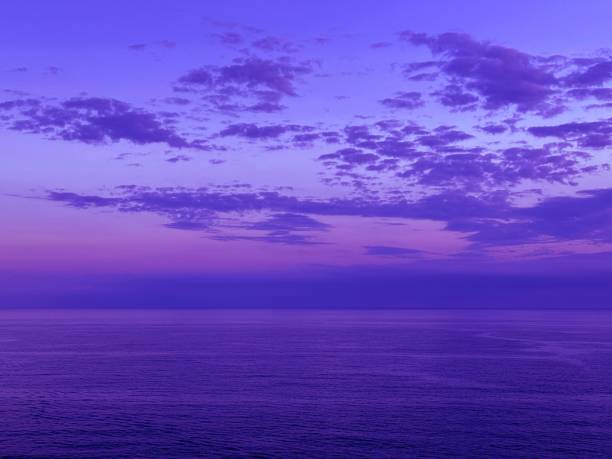 istock Dusk sky clouds over calm ocean at evening 2186194907