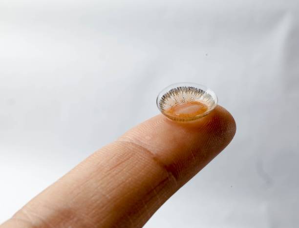 istock Contact lens on fingertip close-up. 2186200159