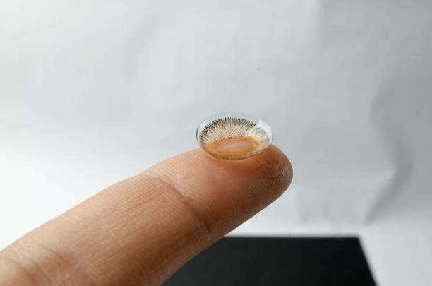 istock Contact lens on fingertip close-up. 2186200232