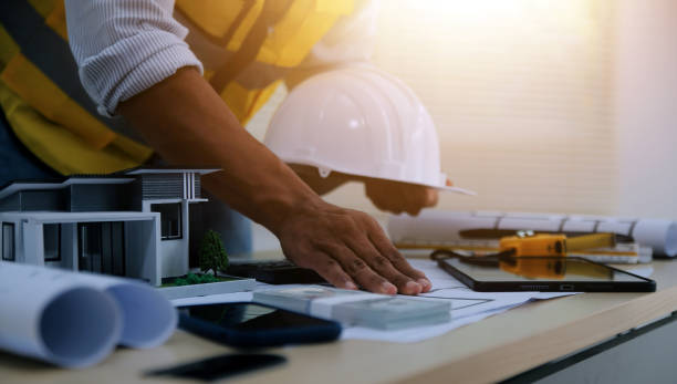 istock Image of engineer meeting for architectural project. working with partner and engineering tools on workplace vintage tone. 2186203548