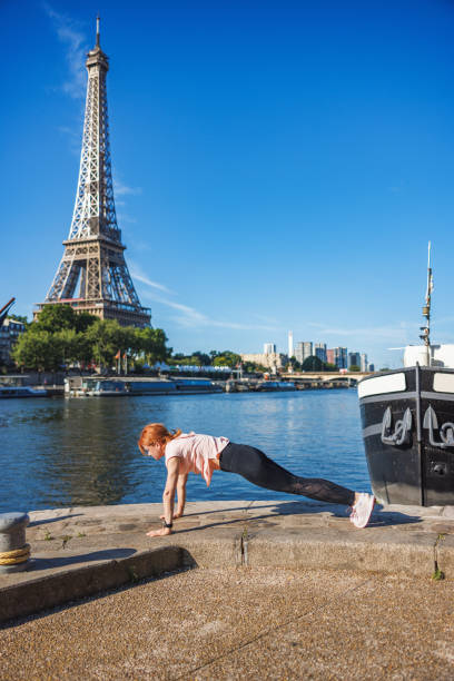 istock Active woman exercising outdoors on Paris waterfront jetty 2186203868
