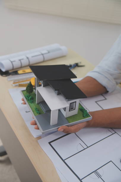 istock Architects, engineers, contractors working in the office with blueprints, inspection engineers Work analysis for architectural plan, construction project sketch, focus, business construction concept. 2186203981