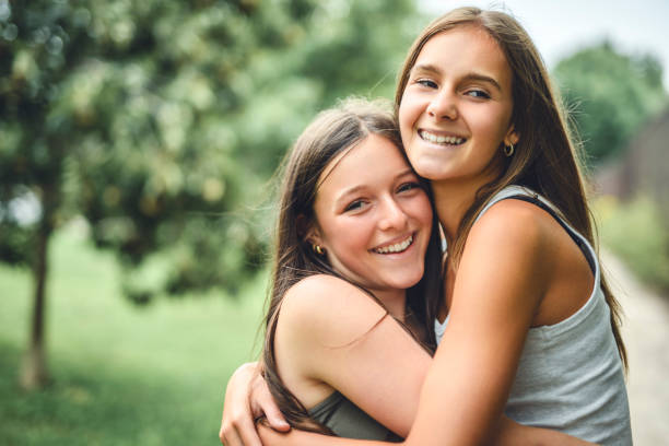 istock Girlfriends having fun outdoors togerher wearing urban clothes 2186205713