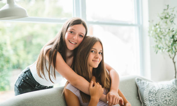 istock Two best girls having fun together on white studio 2186207584