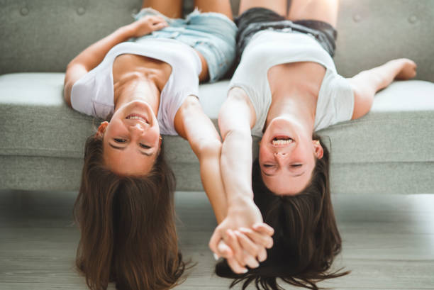 istock Two best girls having fun together on white studio 2186207646