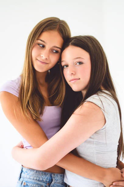 istock Two best girls having fun together on white studio 2186207677