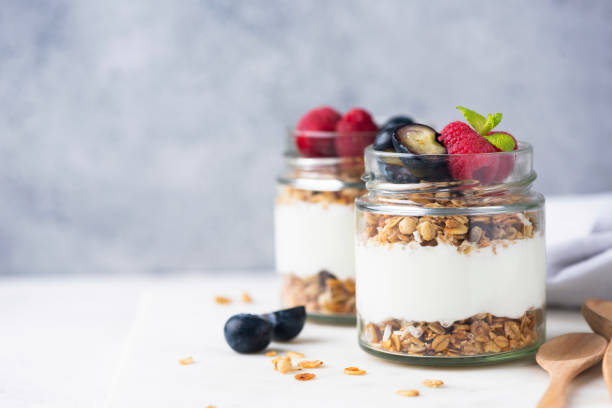 istock Greek yogurt parfait with granola and fresh berries 2186210650