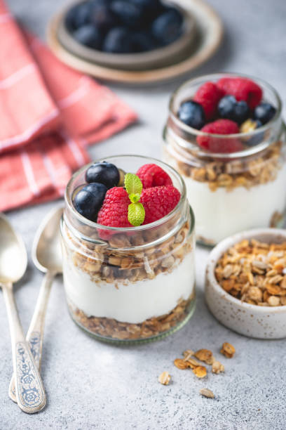 istock Greek yogurt parfait with granola and fresh berries 2186210657