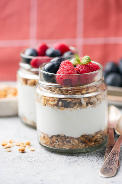 istock Yogurt and granola parfait with fresh berries 2186210693