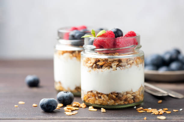 istock Greek yogurt parfait with granola and fresh berries 2186210866