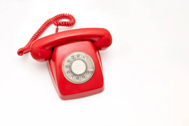 Vintage Red rotary telephone on white background with copy space