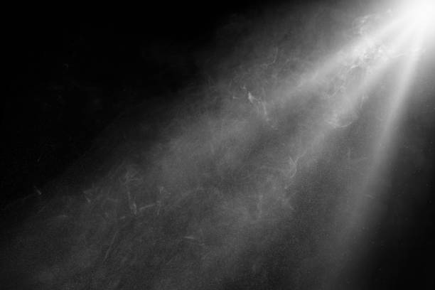 istock grey spotlight effect on stage or crepuscular rays or gods rays with particles isolated on black background 2186217183