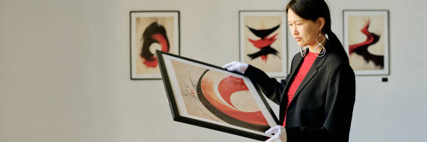 istock Examining Abstract Art Piece in Modern Art Gallery 2186218502