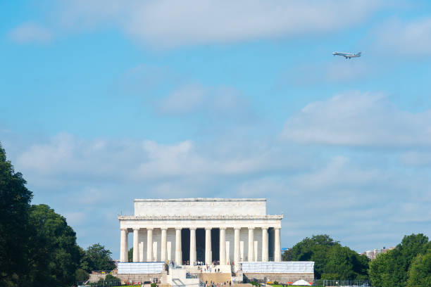 istock Jet airplane overflying Lincoln Memorial on a cloudy day 2186221576