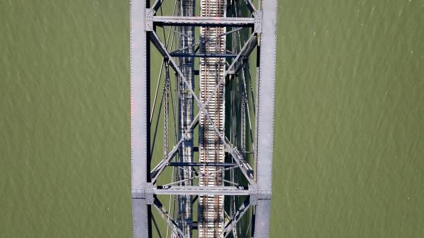 istock Iron truss bridge crossing peaceful river in Charleston, WV 2186228172