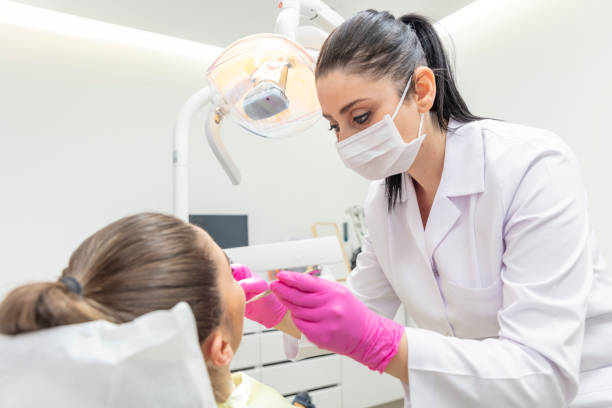 istock Young woman having routine check-ups at the dentist. A modern dental office. 2186236134