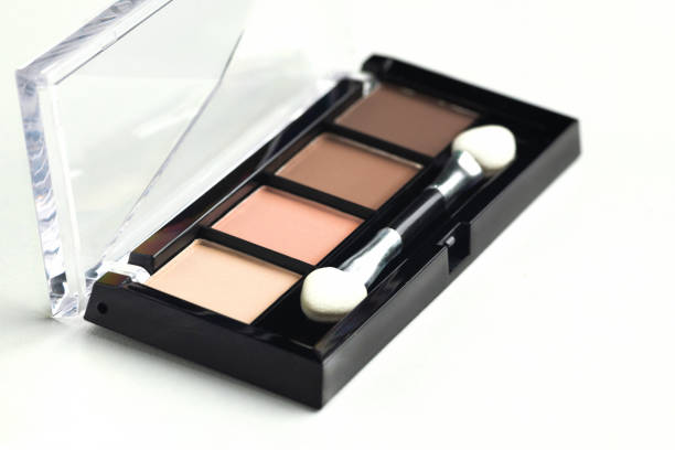 istock A palette of beige, brown warm eyeshadow with an applicator on a white background 2186236718