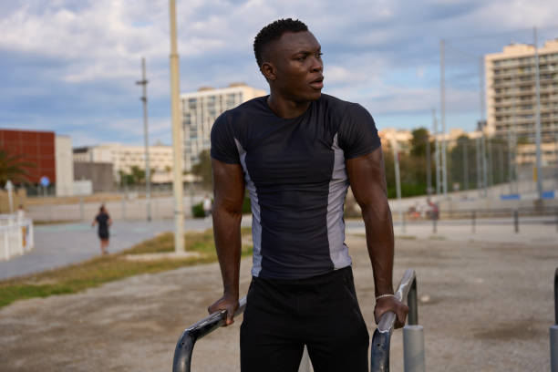 istock Young black man doing calisthenics in urban environment 2186237121